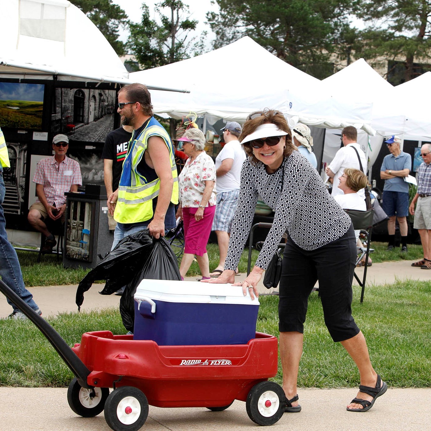 Volunteer delivering water during the art fair