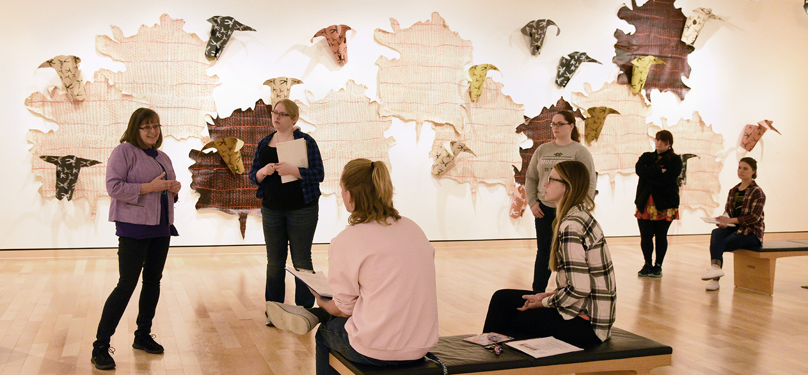 Kandis Barker giving students a tour in the museum