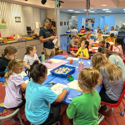 Kids working on art projects at a table