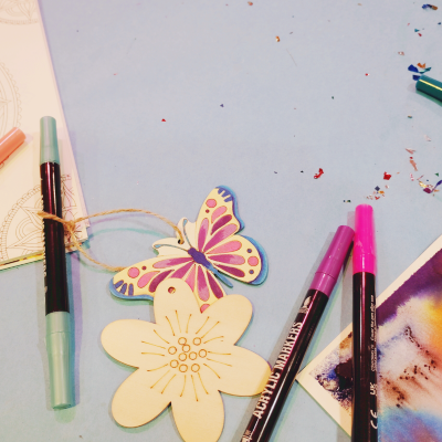art supplies scattered over a light blue background