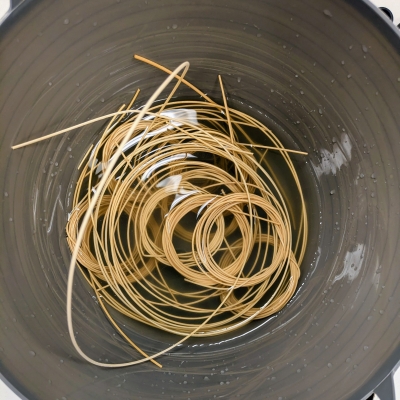 Basket weaving material soaking in a pot
